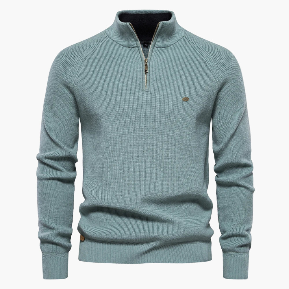 Light blue sweater with a quarter zip on a white background