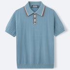 Blue ribbed knit polo shirt with a collar on a light gray background