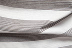 Close-up of striped fabric with black and white lines on a white background