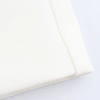 Close-up of a white pillow on a light gray background