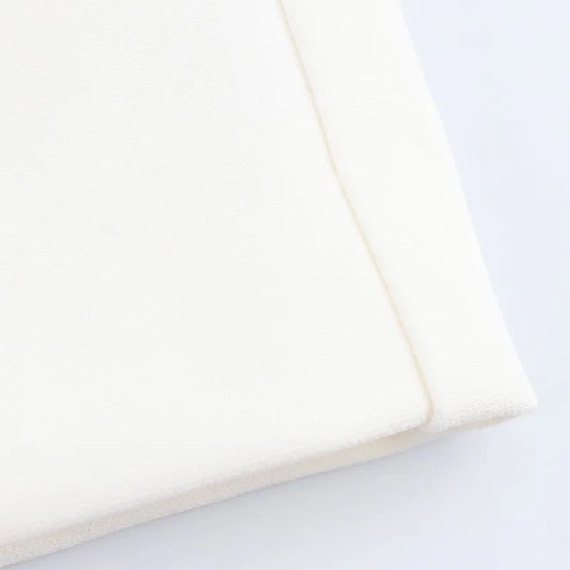 Close-up of a white pillow on a light gray background