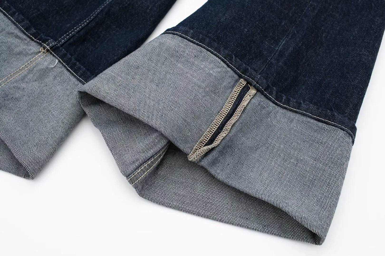 Close-up of a folded denim fabric with a white background