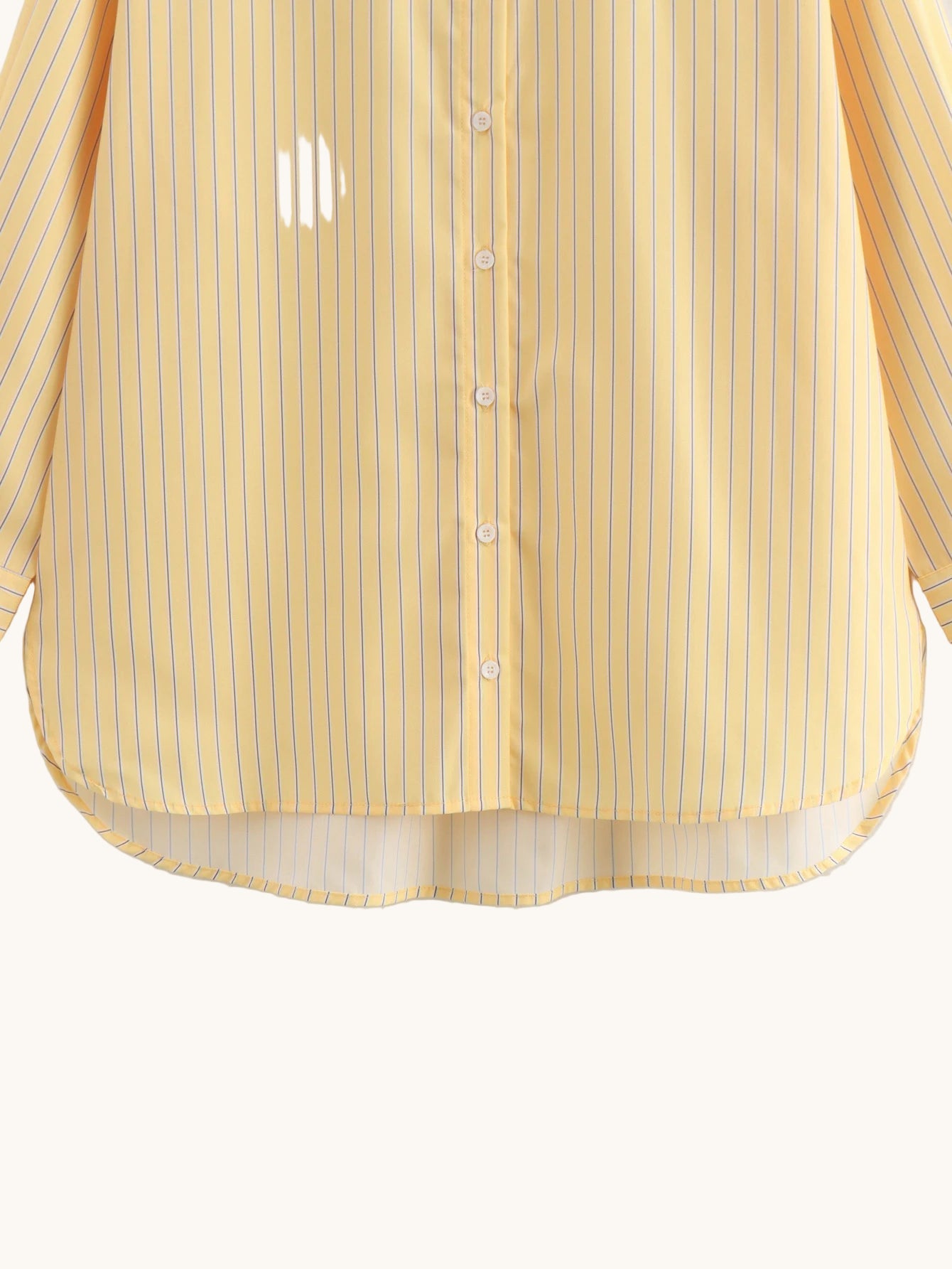 Yellow striped shirt on a light gray background