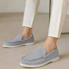 Man wearing suede loafers with trousers.