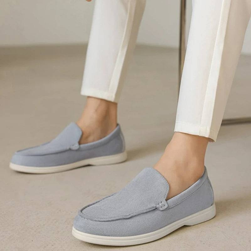 Man wearing suede loafers with trousers.