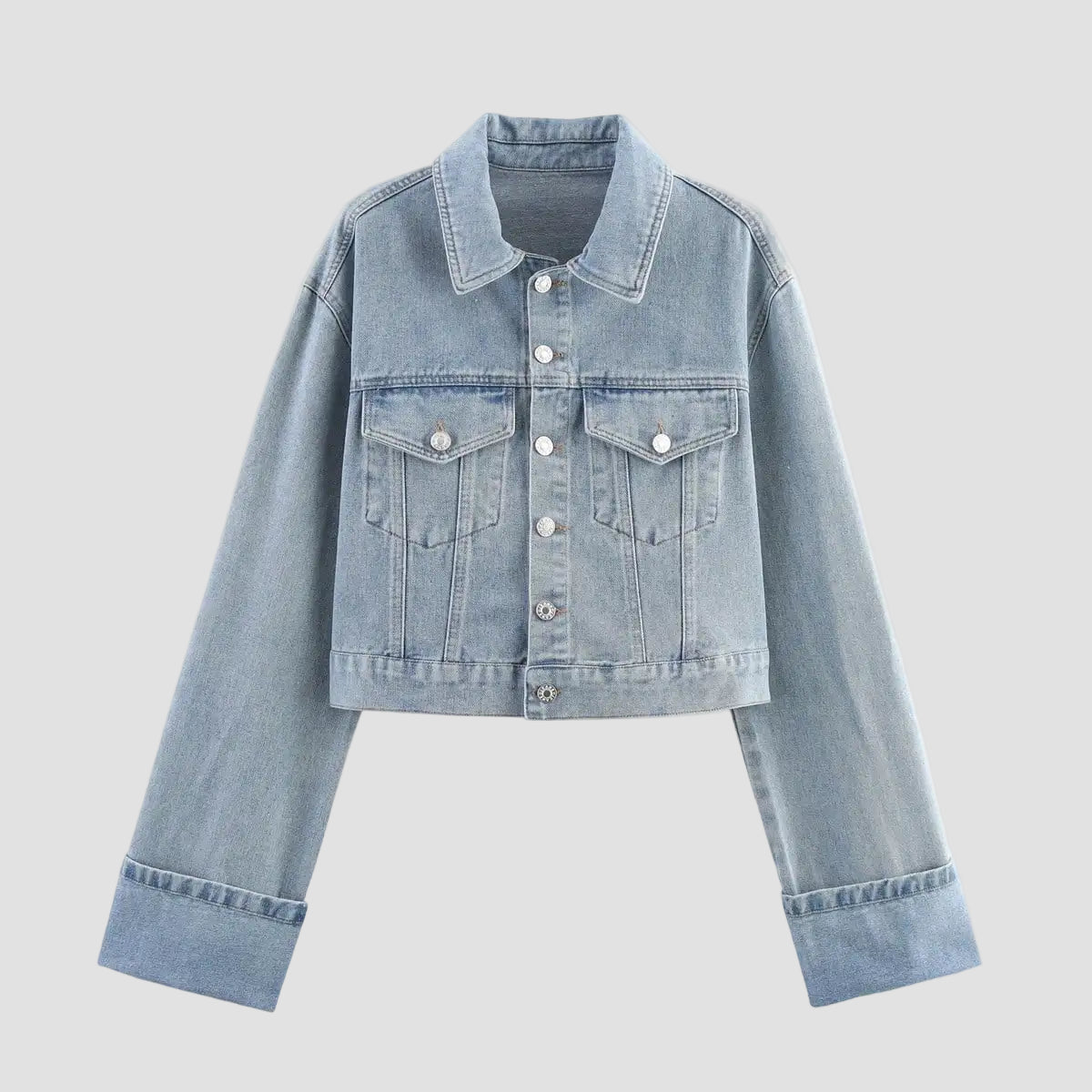 Light blue denim jacket on a white background