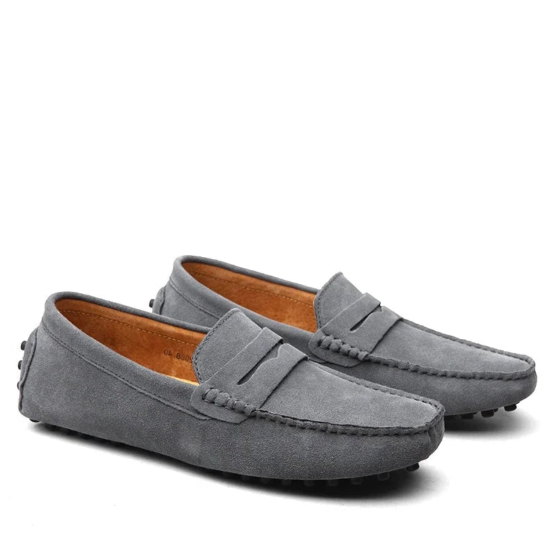 Pair of gray loafers on a white background