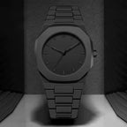 Close-up of the deep black dial and polished silver hands on the Monaco Noir watch.