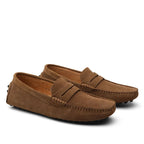Pair of brown suede loafers on a white background
