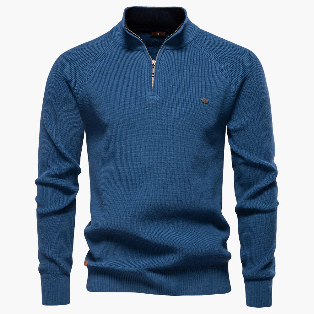 Blue sweater with a quarter zip on a white background