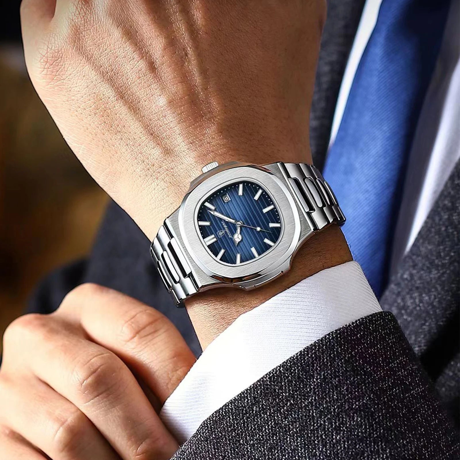 Man wearing the Geneva classic dress watch with a cuffed shirt.