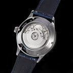 Watch back cover with mechanical components on a black background