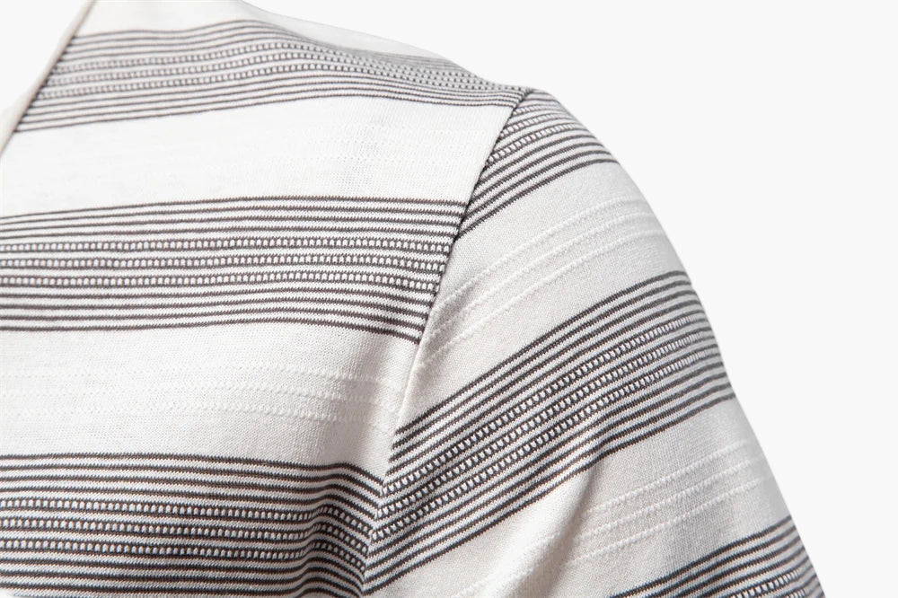 Close-up of a striped fabric with white and gray lines on a white background