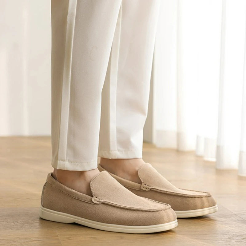 Side profile view of the men's brown suede loafer.