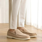 Side profile view of the men's brown suede loafer.