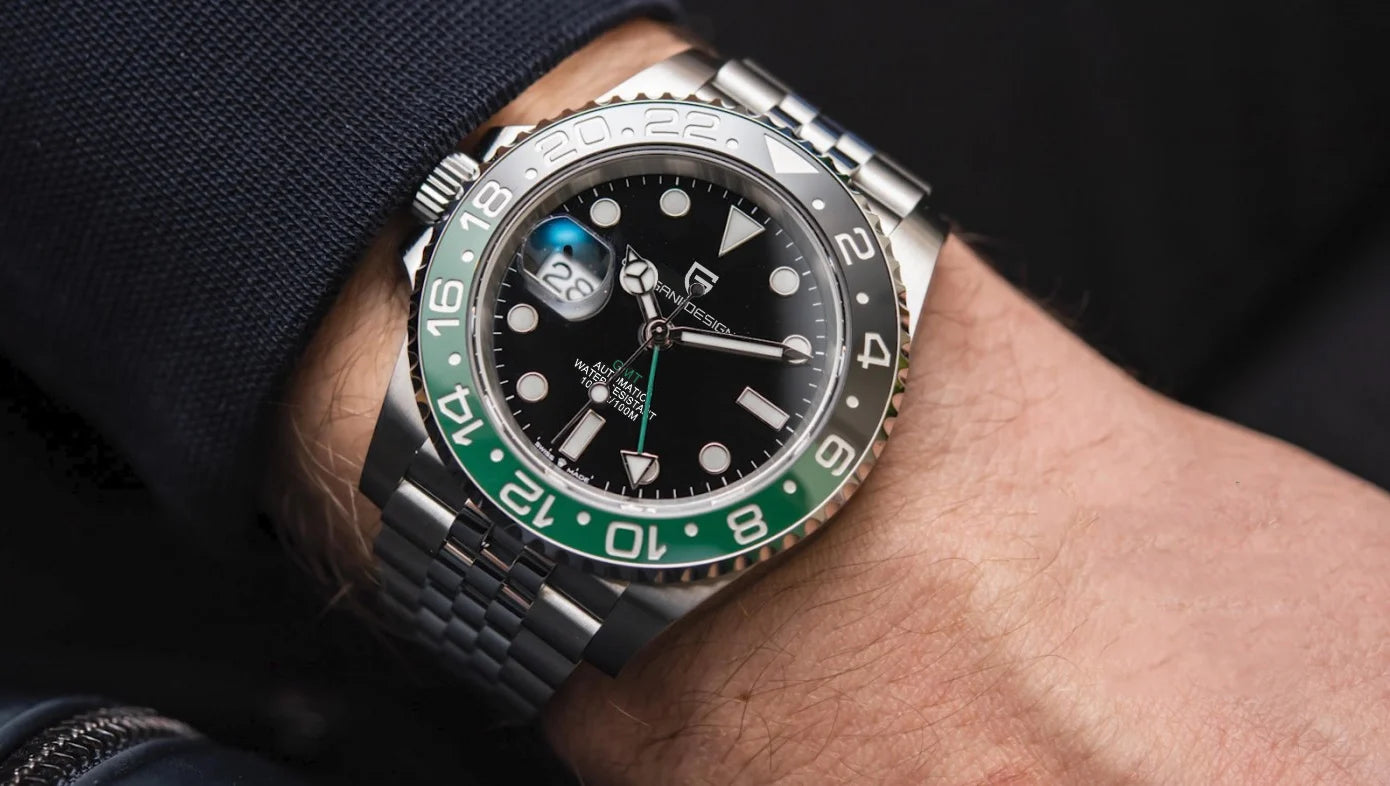 Close-up of a wrist wearing a Rolex watch with a green and black bezel.