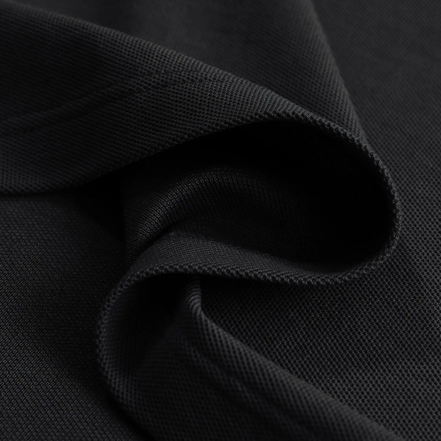 Close-up of black fabric with a textured pattern
