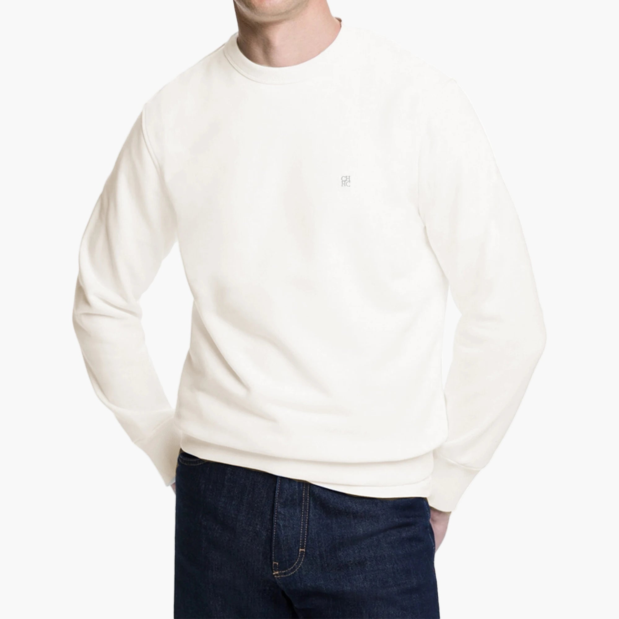 Person wearing a plain white sweatshirt on a white background