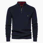 Navy blue sweater with a quarter zip on a white background