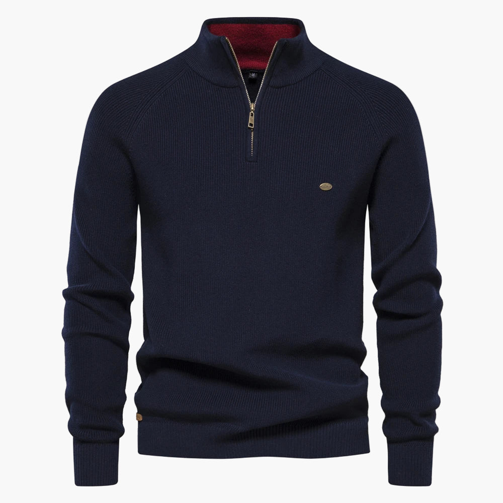 Navy blue sweater with a quarter zip on a white background