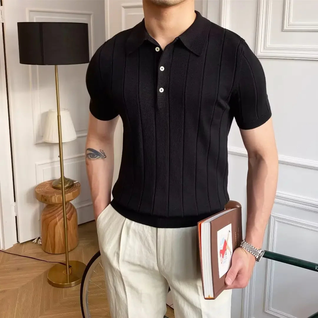Man wearing the Cannes ribbed polo with white trousers at a seaside resort.