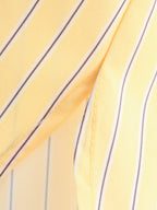 Close-up of yellow fabric with black stripes