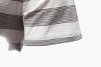 Close-up of a striped fabric with black and white lines on a white background