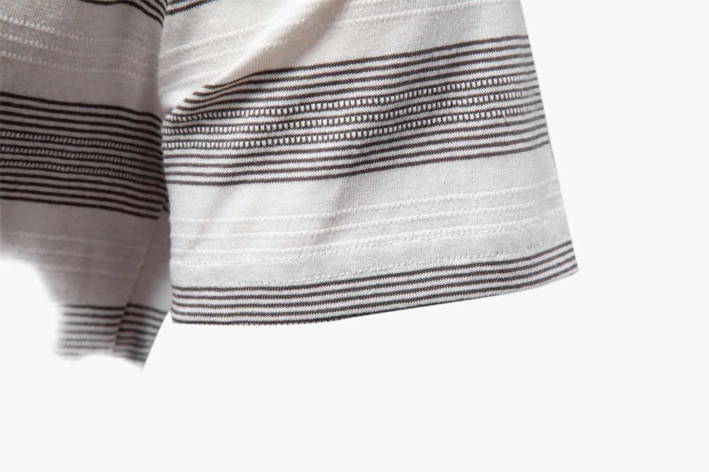 Close-up of a striped fabric with black and white lines on a white background
