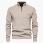 Beige sweater with a quarter zip on a white background