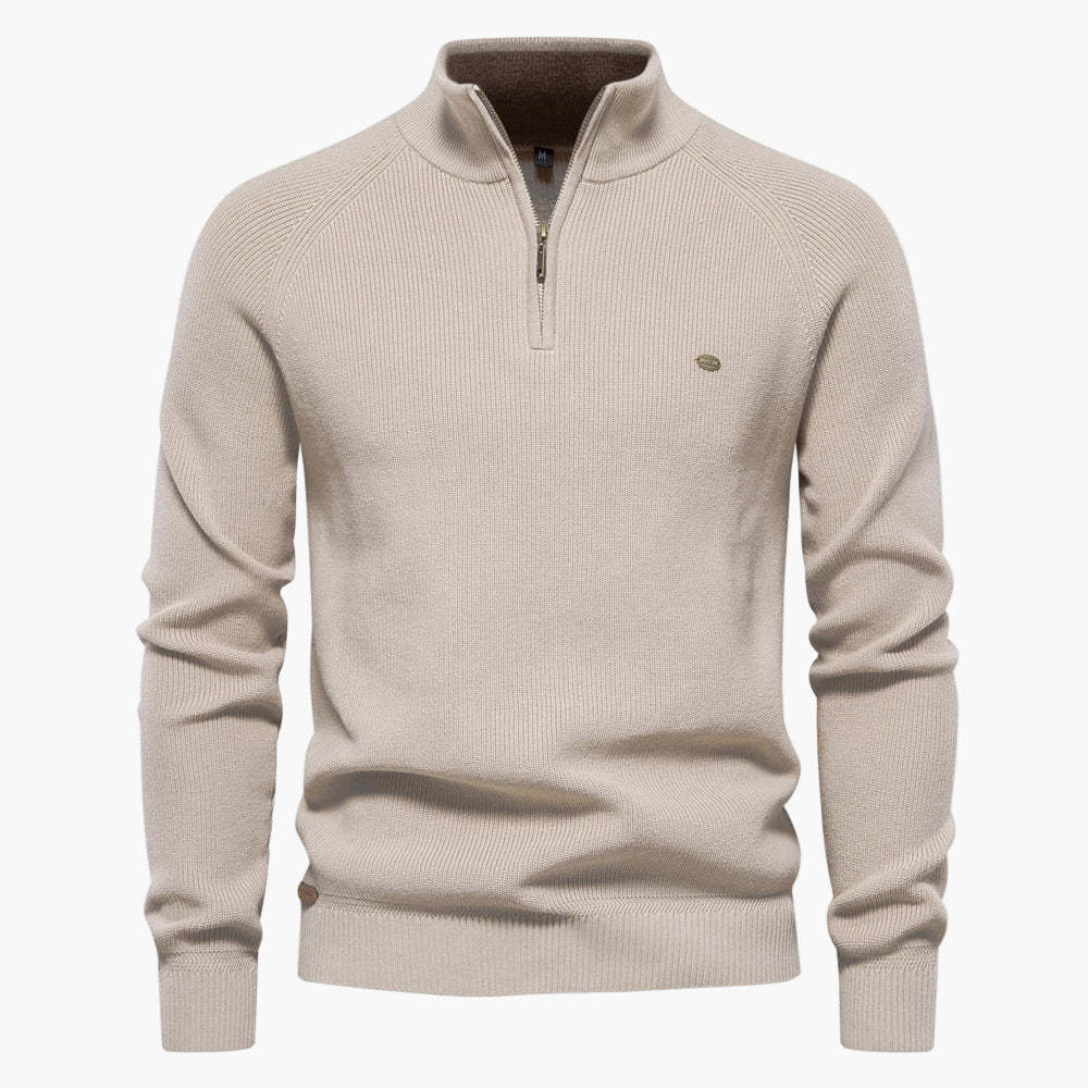 Beige sweater with a quarter zip on a white background
