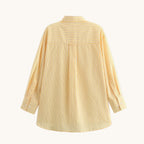 Yellow striped shirt on a white background