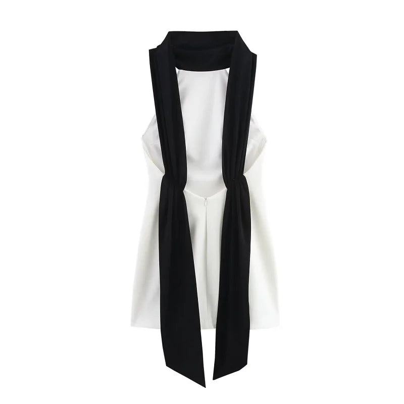 White sleeveless top with black scarf draped over shoulders on a white background