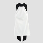 White sleeveless dress with black accents on a white background