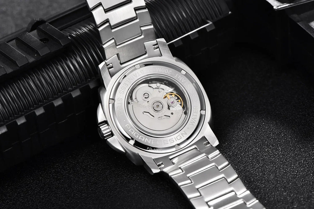 Close-up of a silver watch with mechanical components on a dark background