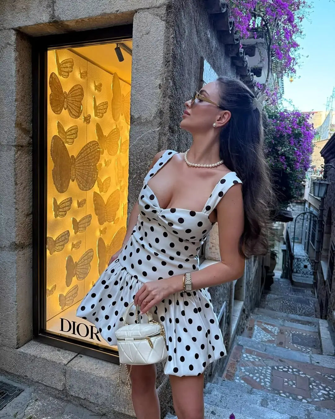 A chic and sexy party look featuring the Altivieri St. Tropez black and white polka dot dress.
