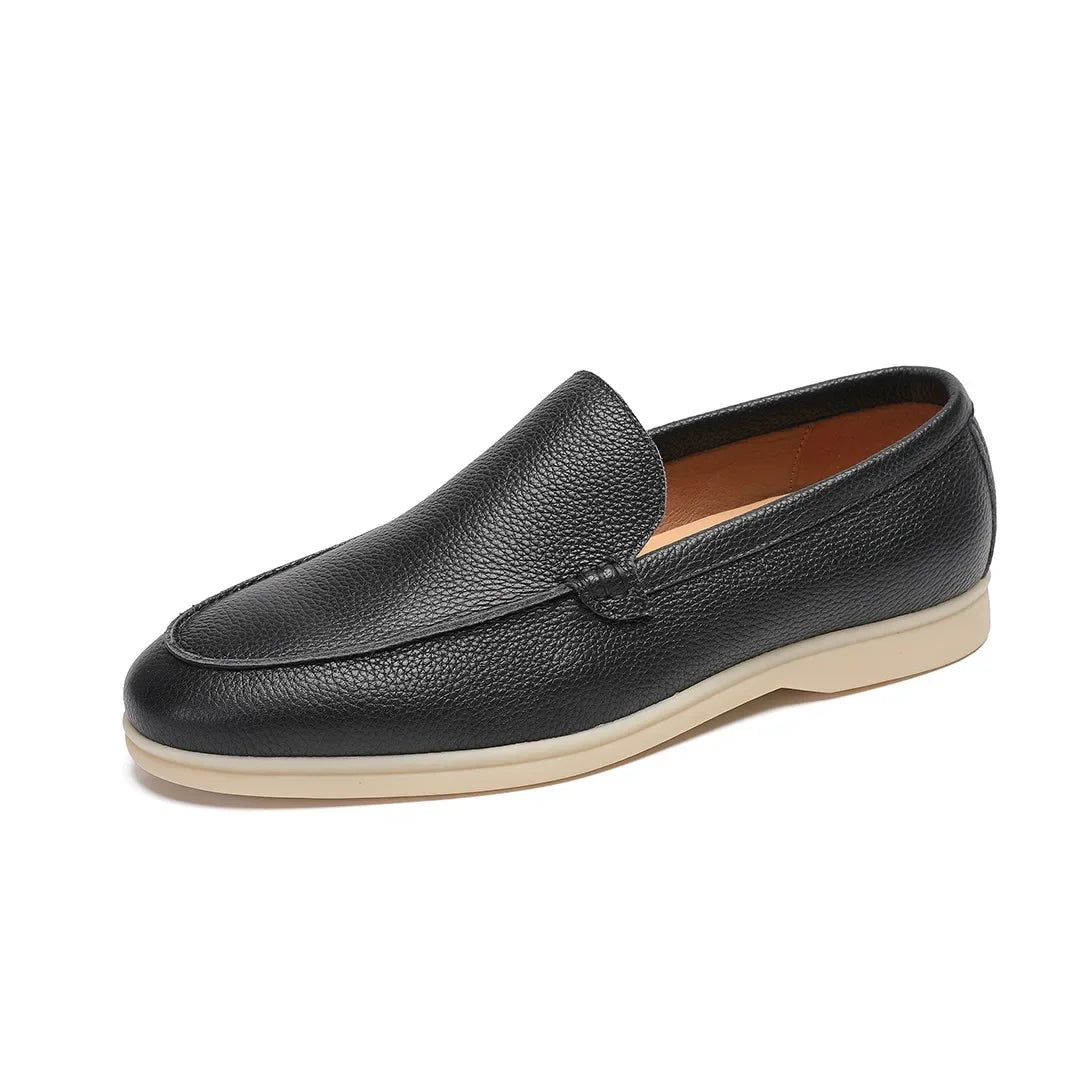Black leather loafer shoe on a white background