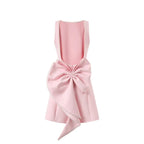 Pink apron with a large bow on a white background
