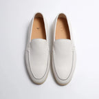 White loafers on a light gray background
