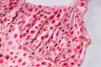 Pink floral patterned fabric on a white background