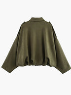 Green cape on a white background