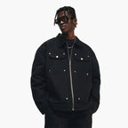 Person wearing a black jacket with silver buttons on a white background, featuring the brand 'SENSIR'.