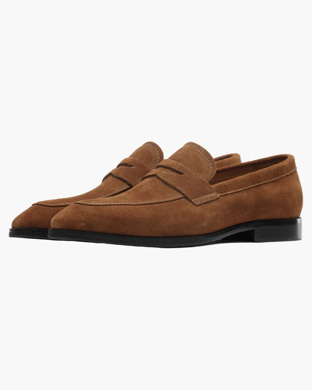 Pair of brown suede loafers on a white background