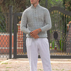 Man wearing the Altivieri cotton half-zip sweater with classic trousers.