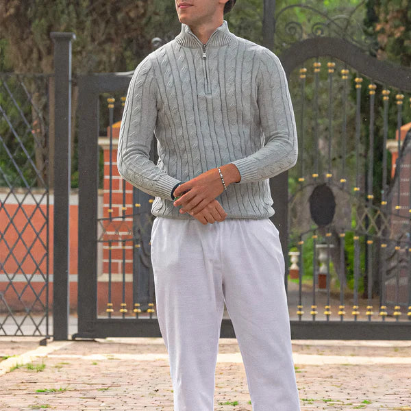 Man wearing the Altivieri cotton half-zip sweater with classic trousers.