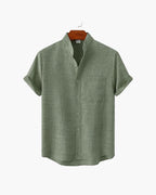 Green short-sleeve shirt on a white background