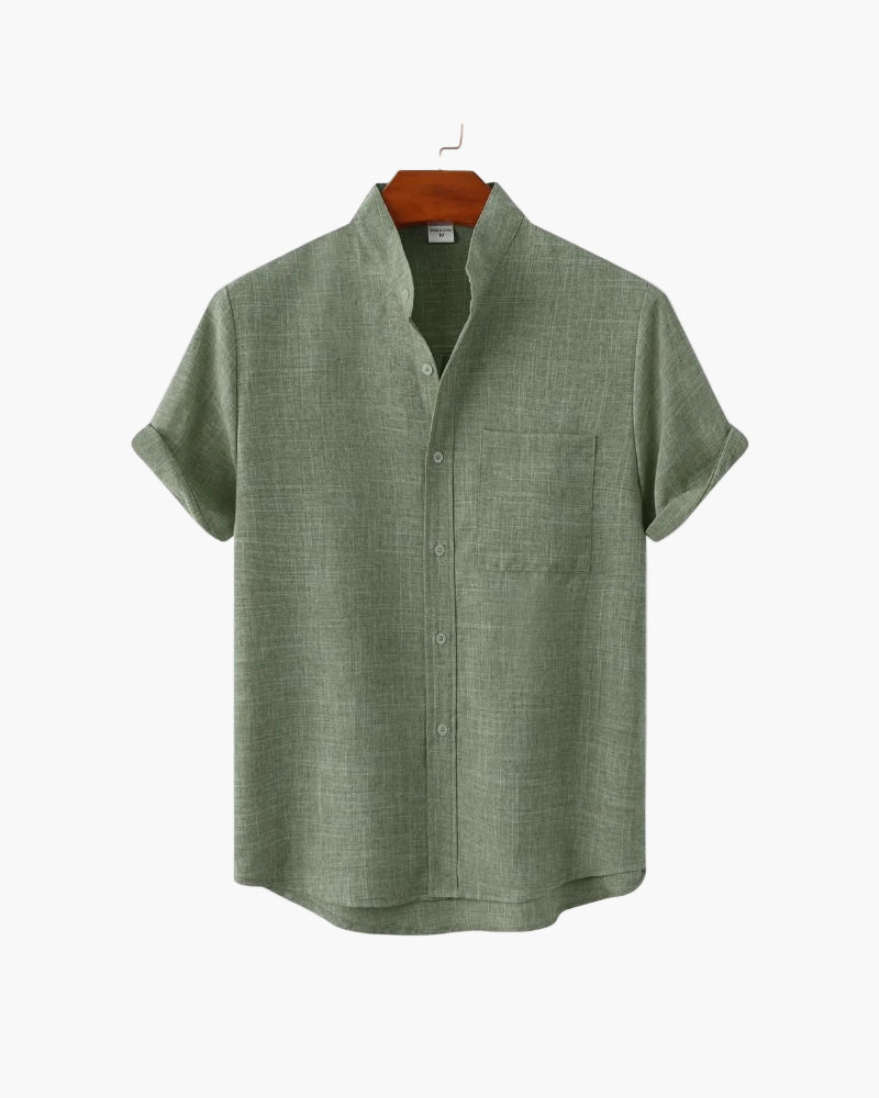 Green short-sleeve shirt on a white background
