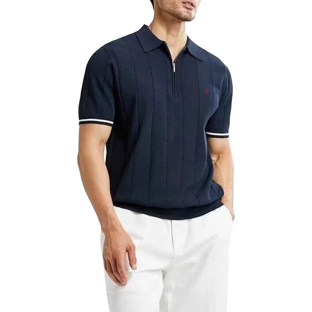 Man wearing a navy blue polo shirt with white trim on a white background