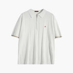 White polo shirt with a small red logo on a white background
