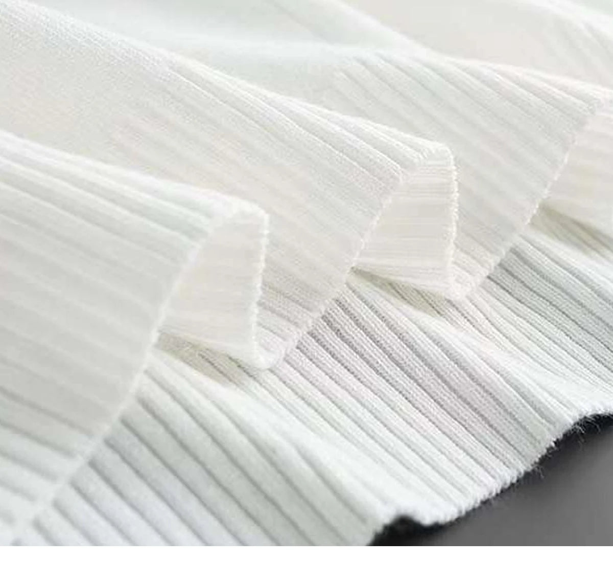 Close-up of white fabric with a subtle pattern