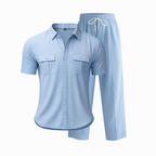 Light blue pajama set with shirt and pants on a white background